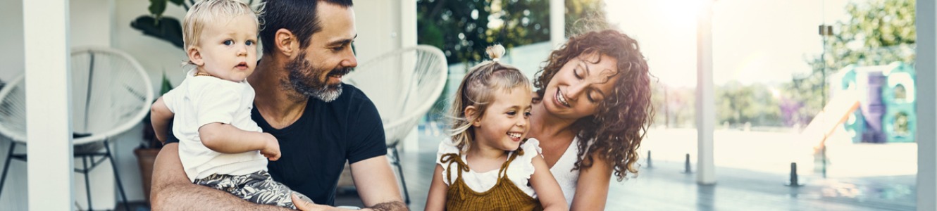 Family on porch of home